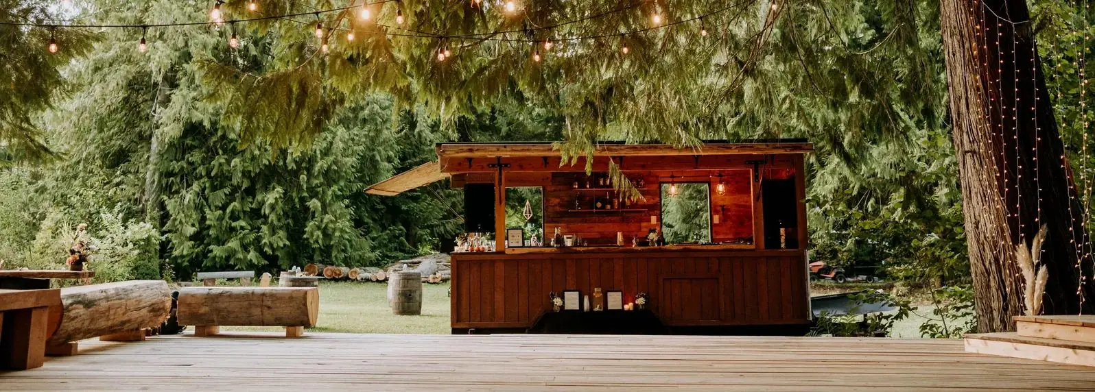 Whistler Boombox timber mobile bar trailer at a forest wedding under cedars and string lights